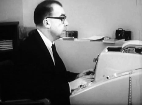 Robert Fano sitting at a teletype