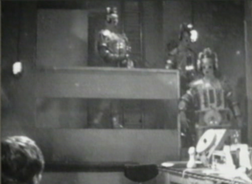 Image: Three Cybermen enter the control room.