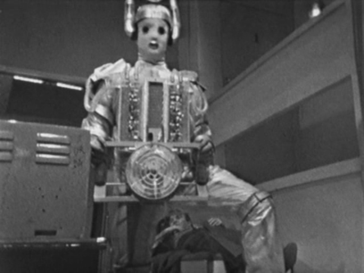 Image: General Cutler is visible in the bottom of the shot between a Cyberman's legs.