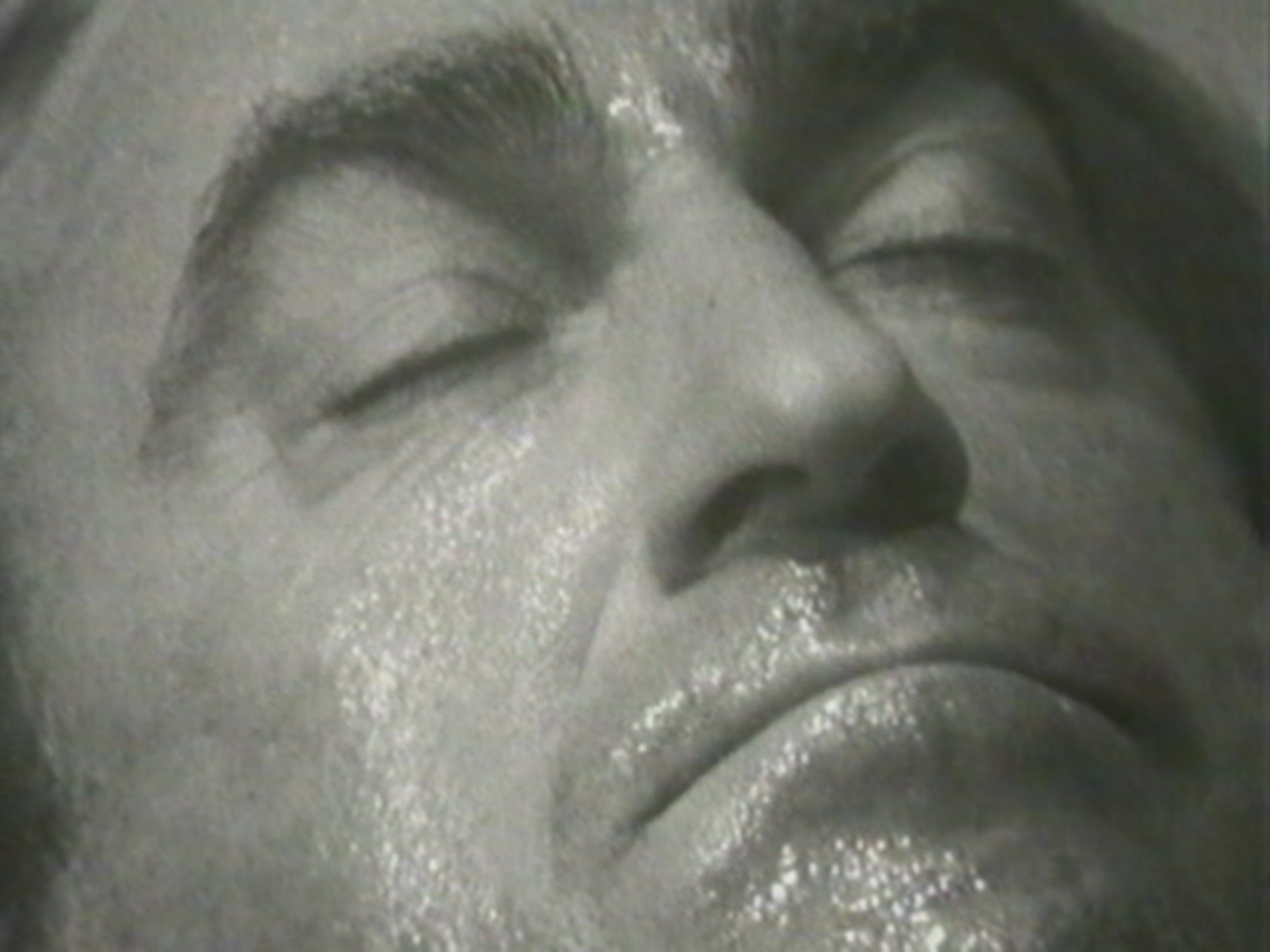 Image: The Doctor unconscious on the floor. He is played by Patrick Troughton.