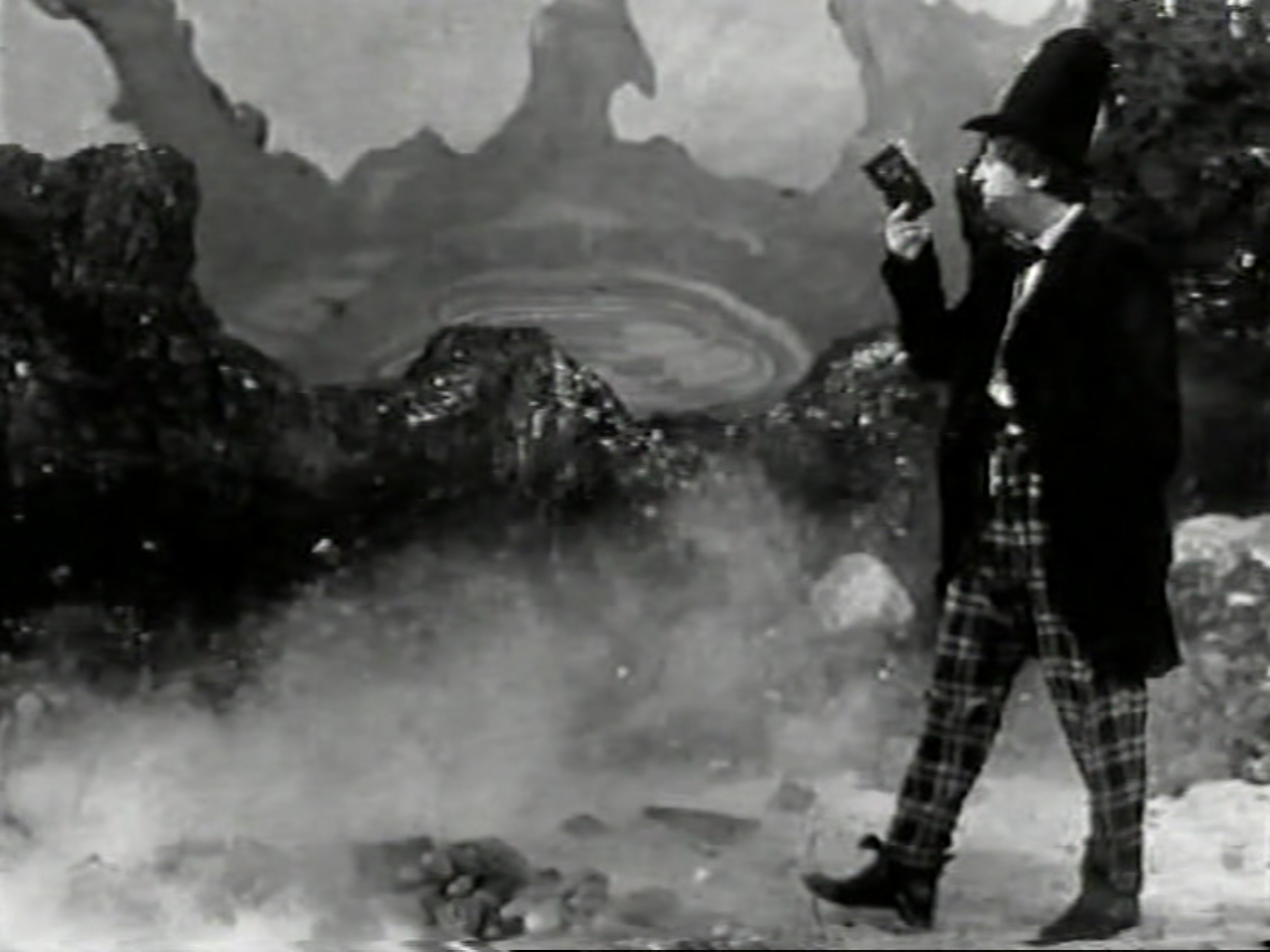 The Doctor walks through the mercury swamps. He is reading a book, not paying attention to his surroundings. He is also wearing a stovepipe hat.