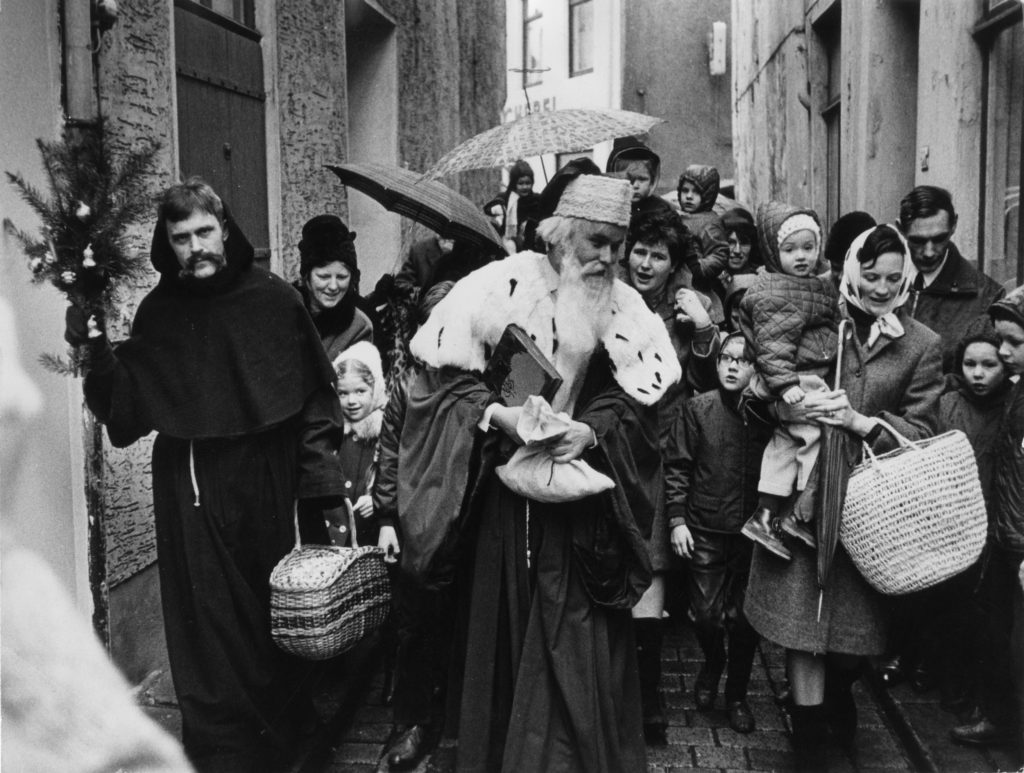 St.Nicholas and his helper Knecht Ruprecht deliver treats and presents to kids in Bremen's historical Schnnor neighbourhood