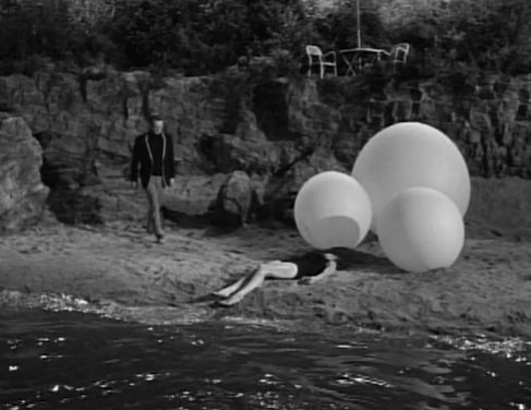 Number Six goes down to the beach to look at another resident who has been dragged ashore by Rover.