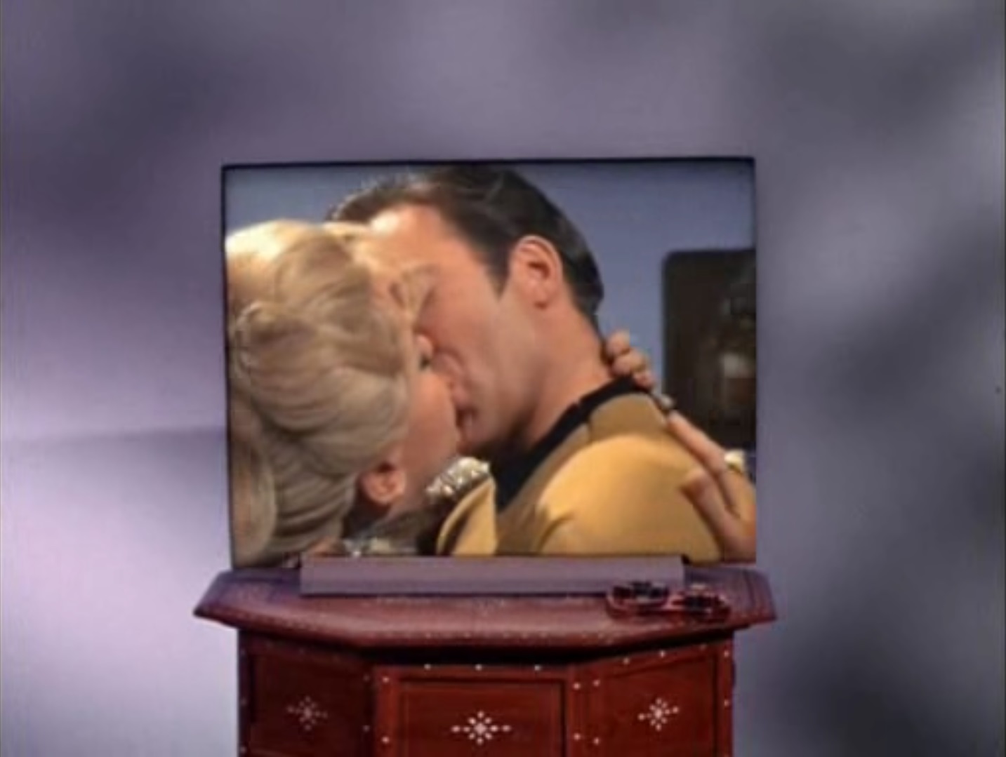 Image of an image on the flat screen viewer of Kirk and Rayna kissing