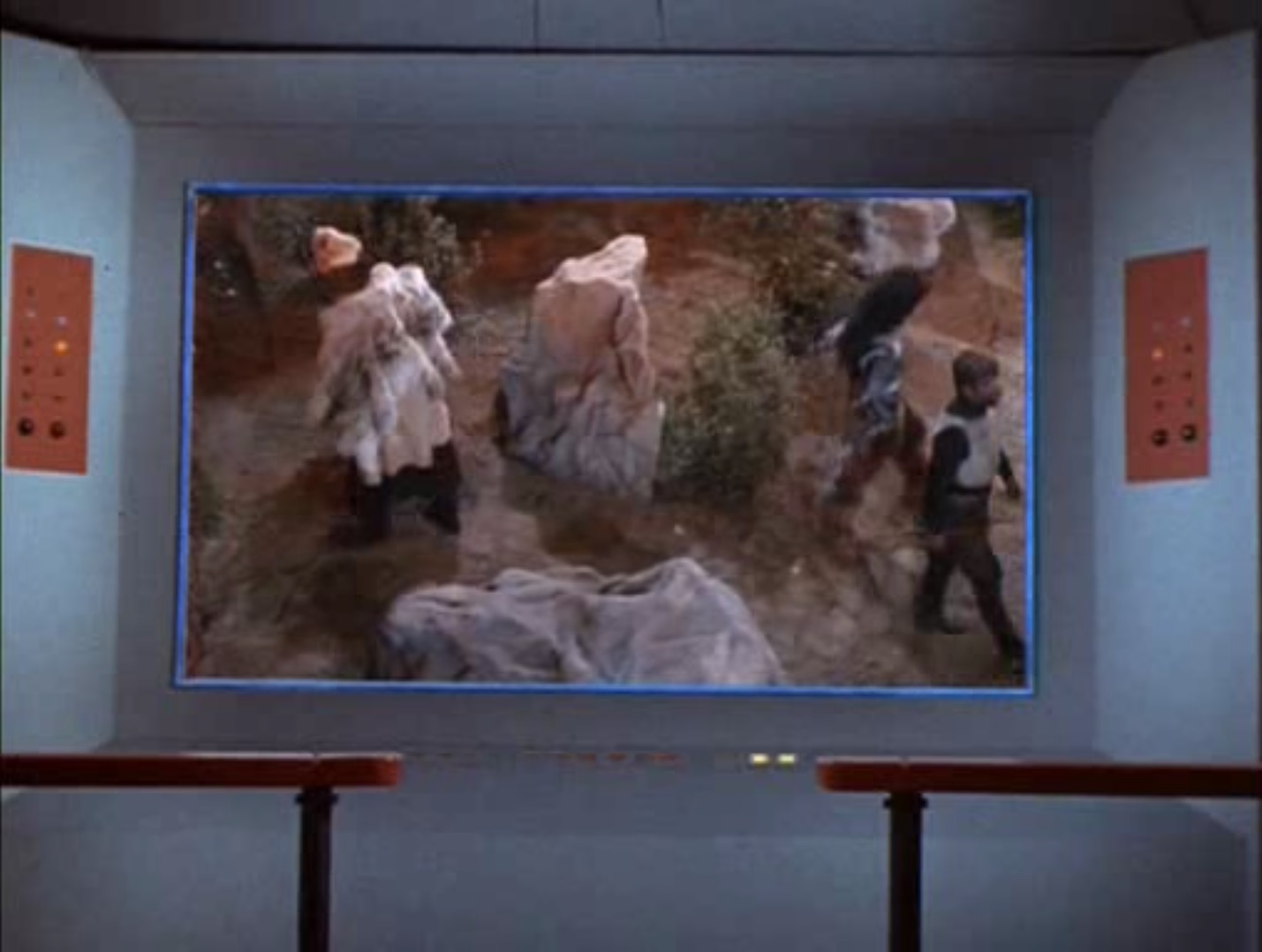 screen cap of the Enterprise view screen showing an overhead shot of the villains Zora, Khan, and Kahless splitting up in rocky terrain to ambush the good guys