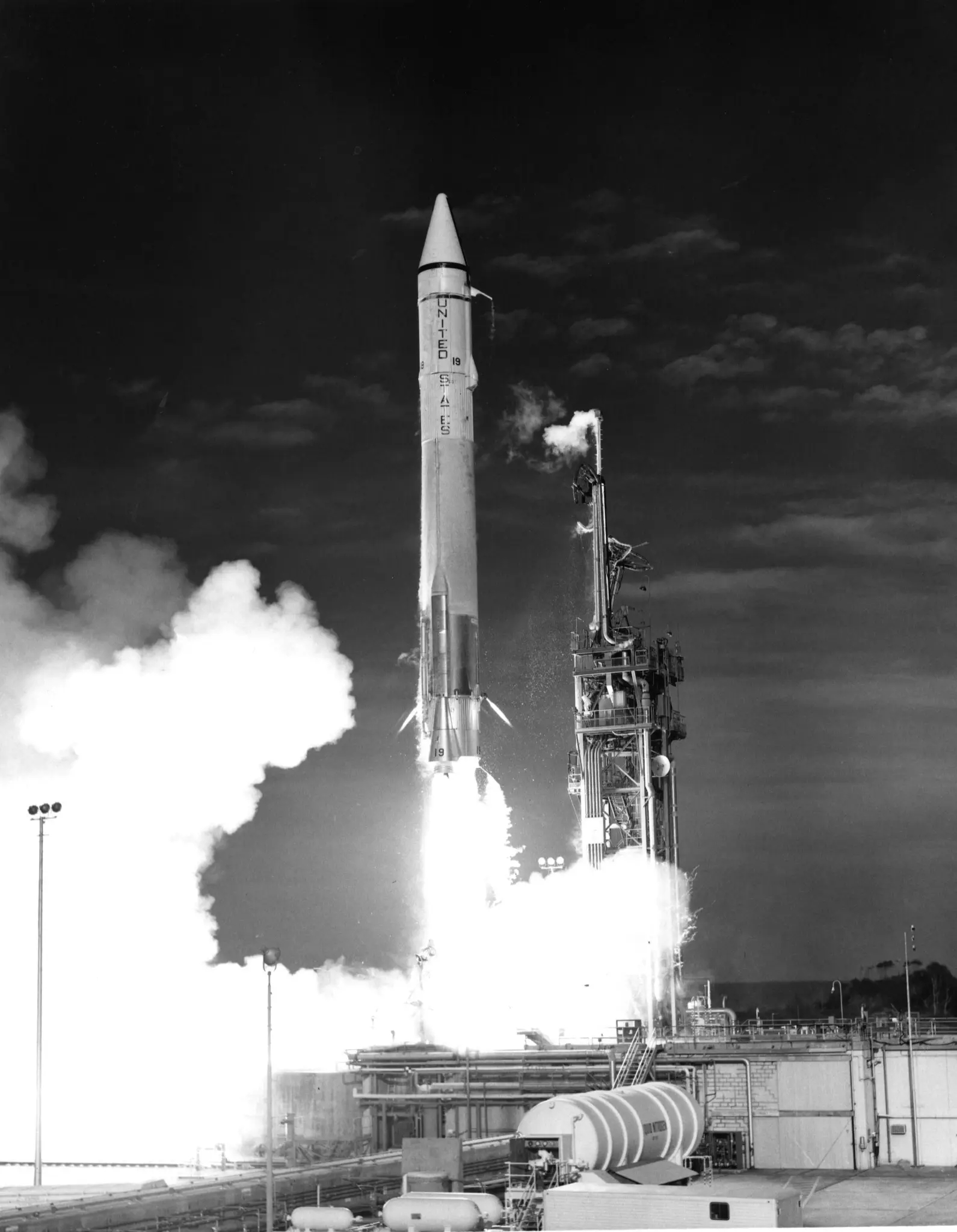 black and white photograph of an Atlas-Agena taking off from Cape Canaveral