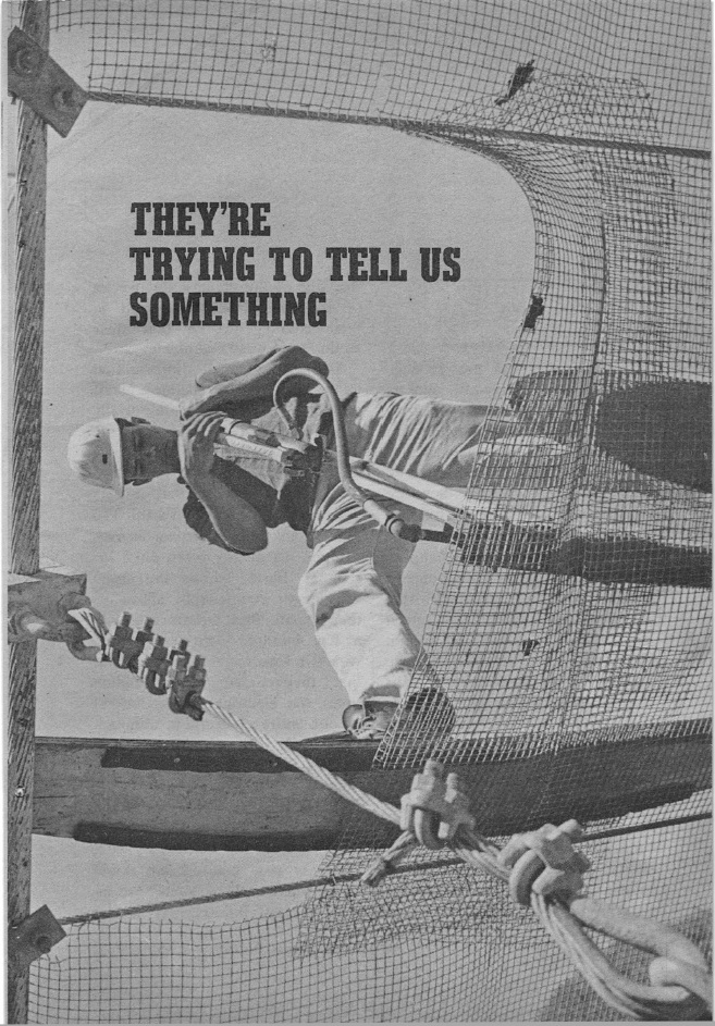 photo from below of a hard-hatted worker atop a radio telescope grid