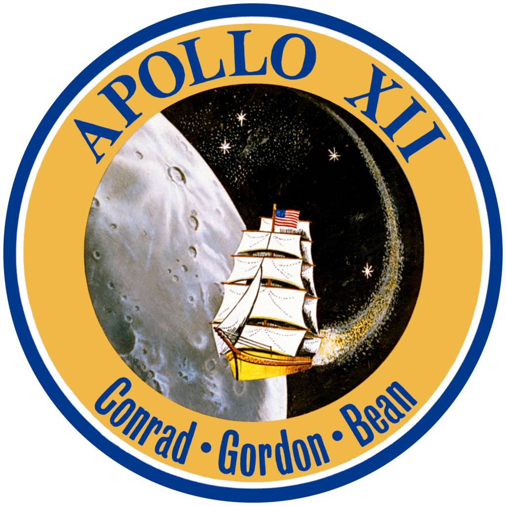 Official crew insignia for the mission. It is circular with concentric thin blue, thin white then thick yellow edges, the latter sporting the text Apollo 12, Conrad, Gordon, Bean. The center of the insignia consists of a drawn picture of a clipper ship in space in front of the Ocean of Storms area of the Moon, where the Lunar Module was to, and did eventually land. The clipper ship was chosen because the all crew comes from the Navy.