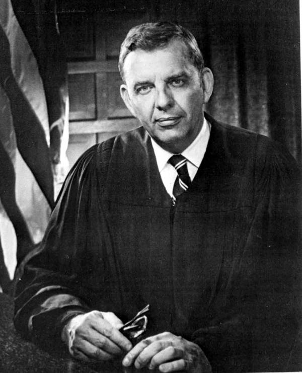 Black-and-white photograph of a white man wearing a judge's robes.