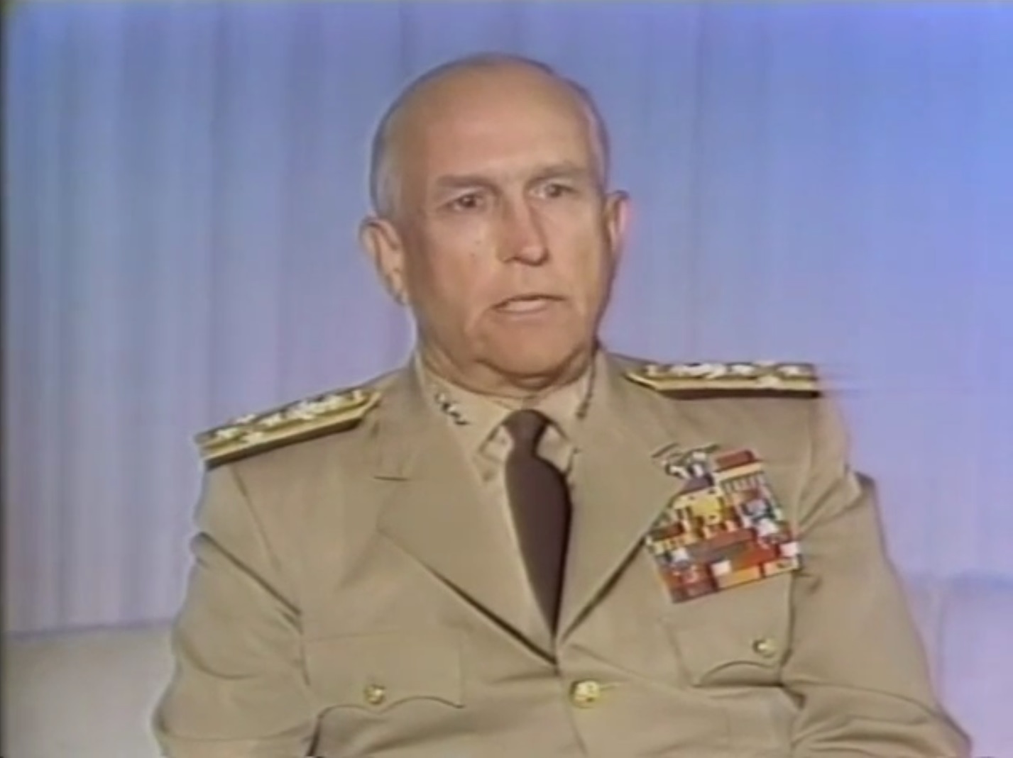 Photograph of a middle-aged white man in a military uniform.