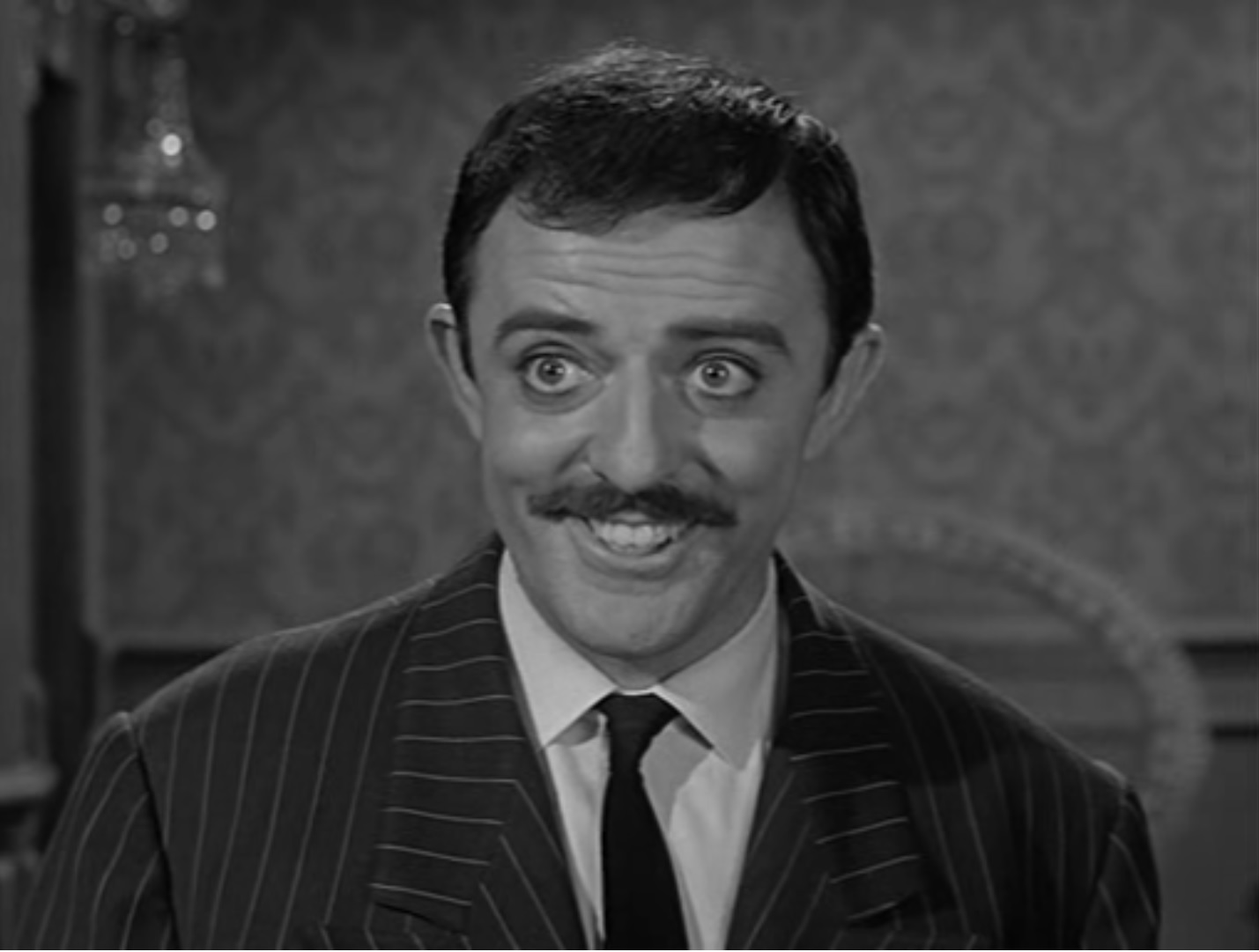 The grinning face of Gomez Addams