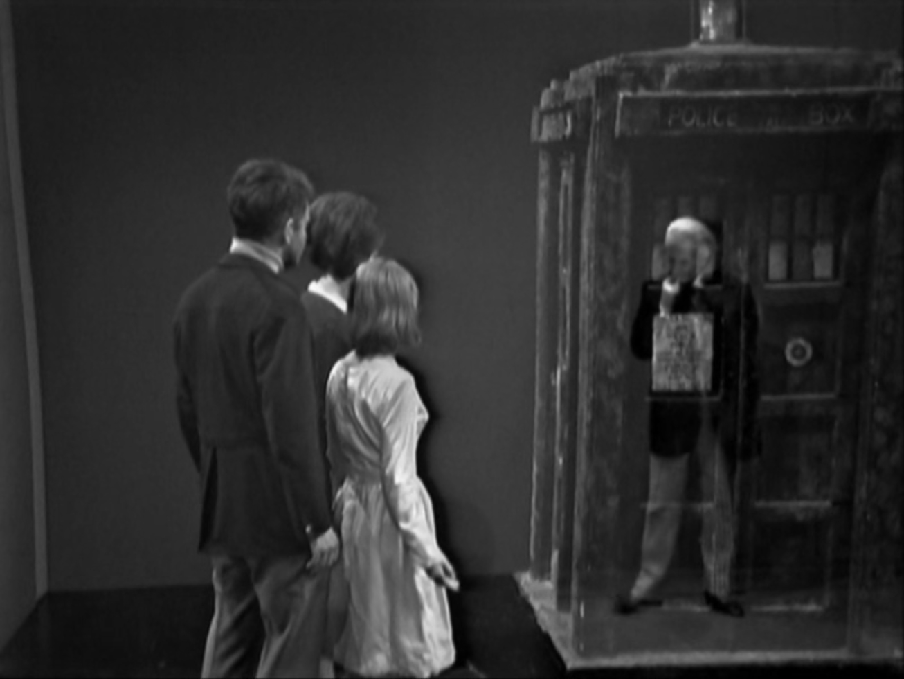 The companions watch as the Doctor stands in the space where the TARDIS seems to be.