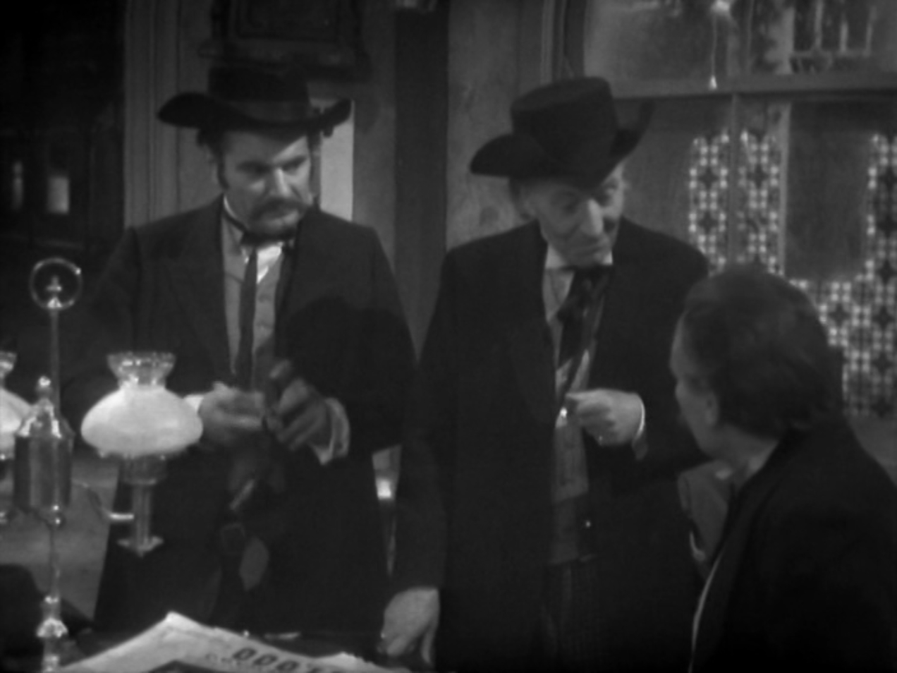 Image: The Doctor talks to Wyatt Earp and Bat Masterson