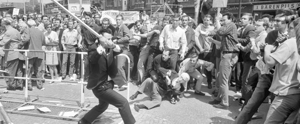 Cheering Persians attack protesters