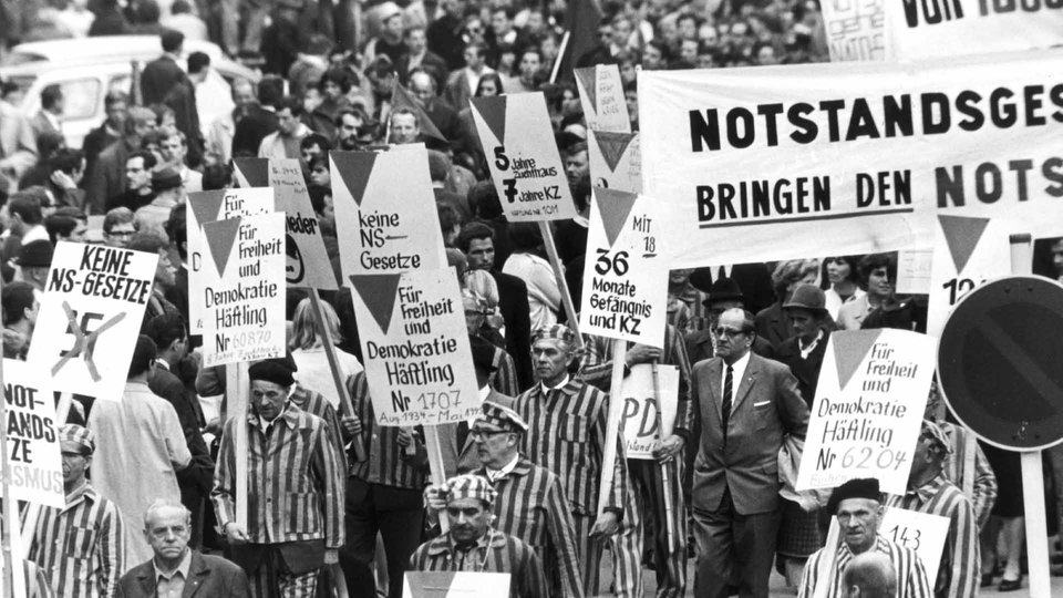 Former concentration camp inmates protest the West German emergency laws