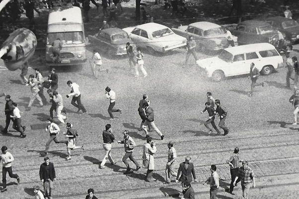 Protesters running from tear gas on the streets of Prague