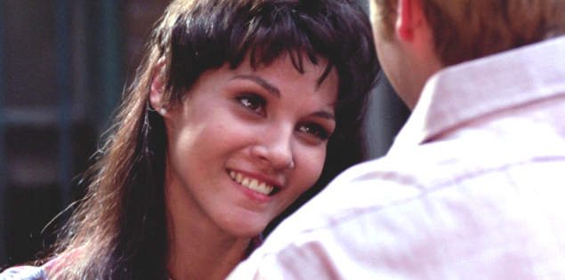 Picture of a Lanie smiling and in conversation, shot from over Elgar's shoulder