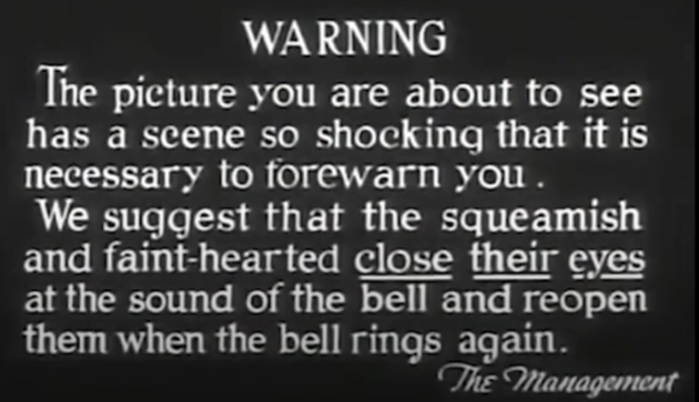 'WARNING: The picture you are about to see has a scene so shocking that it is necessary to forewarn you. We suggest that the squeamish and faint-hearted <u>close their eyes</u> at the sound of the bell and reopen them when the bell rings again. <i>~ The Management</i>'