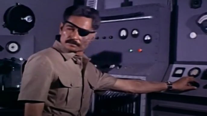 Color image of the Mad Doctor, dressed in khakis. He has a mustache AND an eyepatch.