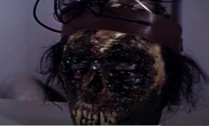 Color image of the globby, partly-decomposed head of the monster.