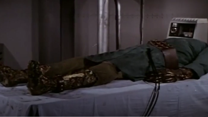 Color image of the monster's fakey body on the surgical table.