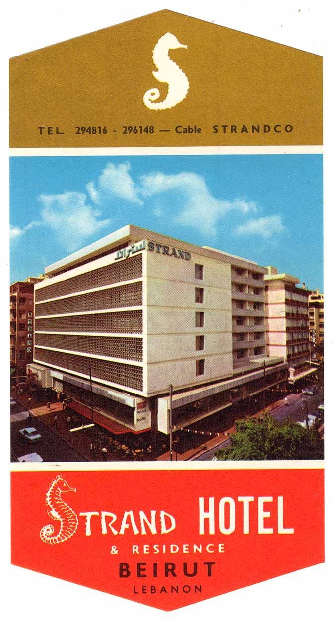 The front of a brochure for the Strand Hotel in Beirut. At the top, a white silhouette of a seahorse is centered over a gold background with the phone number and cable code written in black beneath. Below this is a photograph of the Strand hotel, a large boxy six-story concrete building at a city intersection. Below the photo the words Strand Hotel & Residence are written in white, and Beirut Lebanon in black, both over a red background. the S in Strand is drawn as a seahorse.
