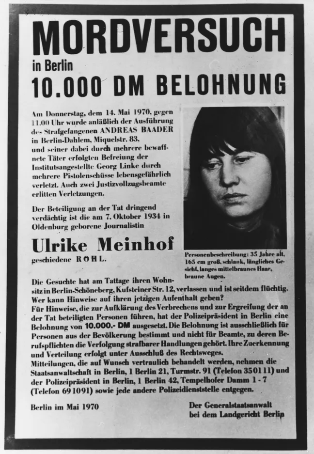 A black and white wanted poster with a small photo of Meinhof next to several paragraphs of German text.