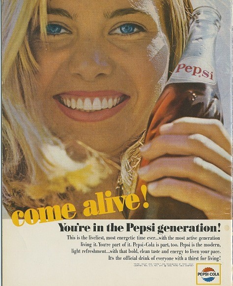 A color ad for Pepsi.  A blonde blue-eyed woman smiles at the camera while holding up a glass bottle of Pepsi.  The text reads, Come alive!  You're in the Pepsi generation This is the liveliest, most energetic time ever... with the most active generation living it.  You're part of it.  Pepsi-Cola is part, too.  Pepsi is the modern, light refreshment... with that bold, clean taste and energy to liven your pace.  It's the official drink of everyone with a thirst for living!