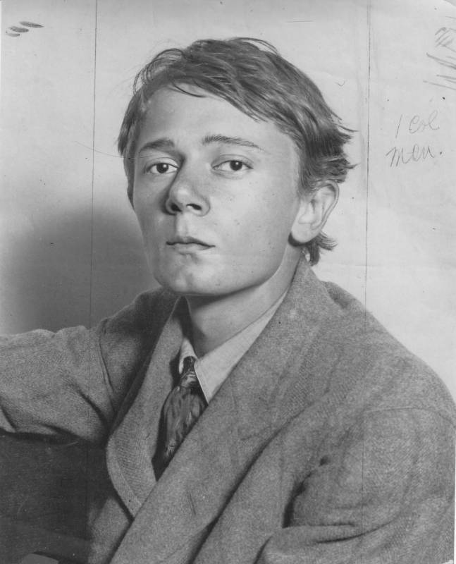 Black-and-white photograph of Clark Ashton Smith in 1912. He's wearing a suit. He looks young and has a serious expression on his face.