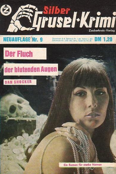 The cover of Der Fluch der blutenden Augen.  Across the top, the Silber Grusel-krimi logo with the skeletal hand as in the previous cover image.  The title is written in bright pink on three small white rectangles positioned at the top left of the image, which is a photo of a naked brunette woman with straight-cut bangs.  She is looking blankly at the viewer with her lips slightly parted.  Her left hand, wrapped in thin silver necklace chains, rests on her right shoulder.  Behind her, a cobwebbed human skull rests atop a chest behind a pile of coins.
